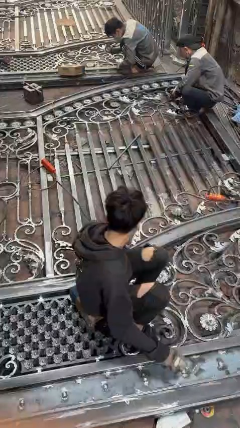Shalimar workshop team assembling ornate steel gate leaves
